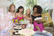 Bride sitting  together with her Friends showing engagement ring at Bridal Shower