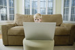 View of a cute boy looking at a laptop.