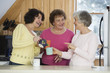Women conversing at a tea party.