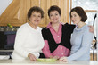Portrait of women standing together.