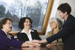 Photo: View of smiling business women conversing with each other. View of smiling business women conversing with each other.