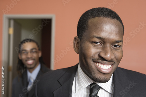 Photo: Portrait of smiling young businessmen. Portrait of smiling young businessmen.