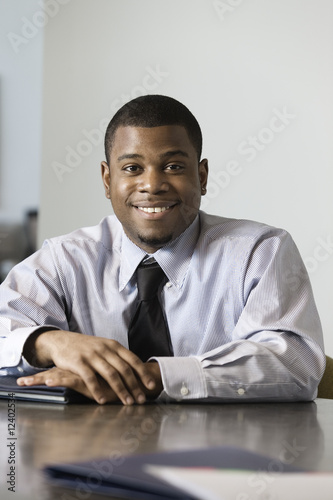 Photo: Portrait of a business man smiling. Portrait of a business man smiling.
