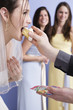 Side view of a bride eating cake.