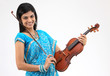 Teenage girl in fancy sari playing violin
