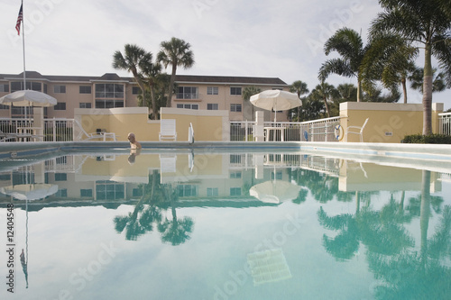 Photo: Senior man swimming in a pool Senior man swimming in a pool