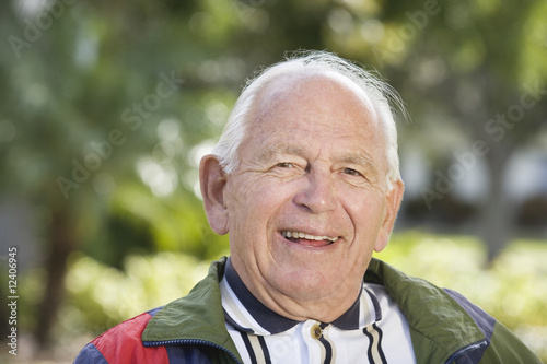 Photo: Portrait of a senior man smiling. Portrait of a senior man smiling.