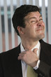 Portrait of business man adjusting his necktie.