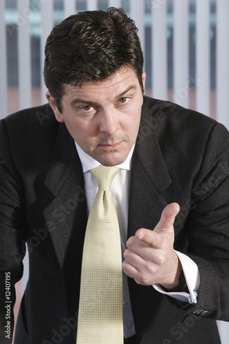 Photo: Portrait of a business man gesturing. Portrait of a business man gesturing.