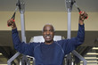 senior man working out on weightlifting machine