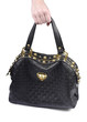 Girl's hand holding black woman handbag isolated on white backgr