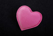 Pink heart macro isolated on black velvet background. Pink heart macro isolated on black velvet background.