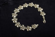 White and yellow gold bracelet isolated on black velvet backgrou