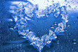 heart from ice on blue background