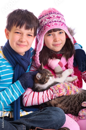 Photo: Boy and girl holding cat Boy and girl holding cat