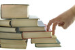 Stack of books and fingers step isolated on the white background Stack of books and fingers step isolated on the white background