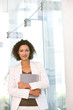 Portrait of attractive business woman holding folder Portrait of attractive business woman holding folder