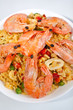 Spanish paella in a white bowl close-up