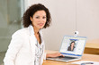 Attractive business woman working on laptop