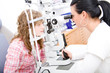 Beautiful young doctor inspect a patient in ophthalmology labor Beautiful young doctor inspect a patient in ophthalmology labor