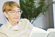 Old woman reading book