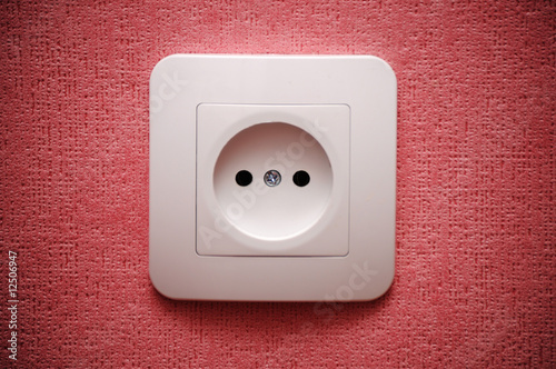 Electric plug connector (outlet) on the wall