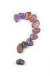 Question Mark written in tumbled crystal stones