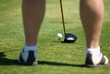 A golfer's feet before preparing to put A golfer's feet before preparing to put
