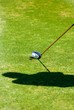 Golfer's shadow while preparing to put Golfer's shadow while preparing to put