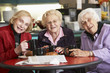 Senior women drinking tea together Senior women drinking tea together