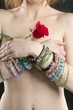 Nude redhead woman, jewelry and rose Nude redhead woman, jewelry and rose