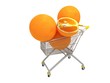 Huge oranges on the shopping cart isolated on white