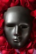 Black carnival mask with red rose petals Black carnival mask with red rose petals
