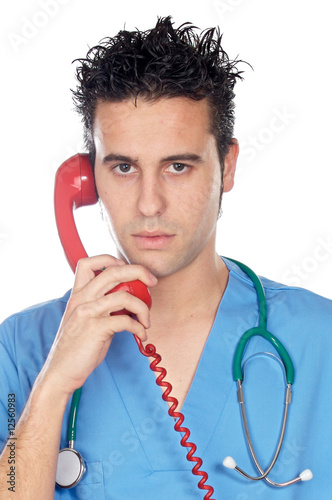 Foto: Doctor speaking on the telephone Doctor speaking on the telephone