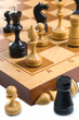 Chessmens on a chessboard, white background