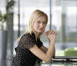 A businesswoman sitting in a modern office