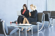 Two women looking at a laptop