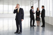 A letting agent showing business people around empty office