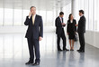 A letting agent showing business people around empty office