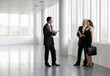 A letting agent showing businesspeople around an empty office