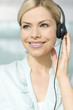 A woman wearing a headset