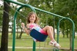 Beautiful little girl playing with swing Beautiful little girl playing with swing