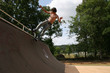 Attractive 16 year old boy on skateboard at skatepark. Attractive 16 year old boy on skateboard at skatepark.