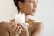 A woman holding a candle