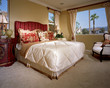 Traditional Bedroom with Ornate Nightstand and Red Accents