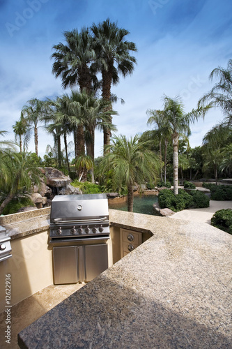 Photo: Outdoor Kitchen Area overlooking Swimming Pool Outdoor Kitchen Area overlooking Swimming Pool