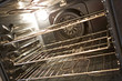 Inside of black convection oven with wire racks
