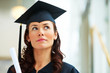 Young female graduate looking at copyspace Young female graduate looking at copyspace
