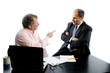 two business partners at desk discussion argument