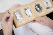 A senior woman looking at old family photographs